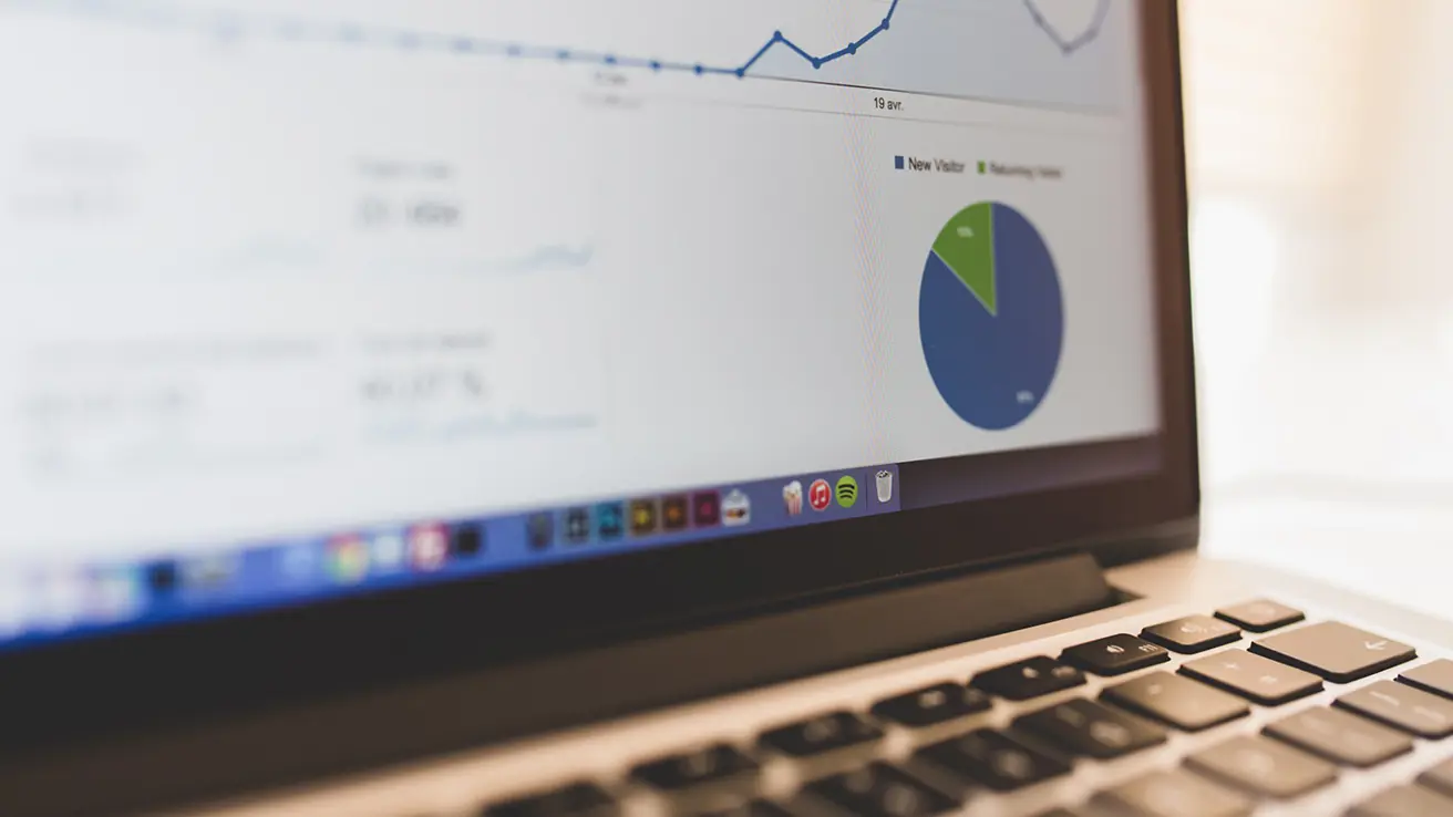 A laptop with Google Analytics on the screen
