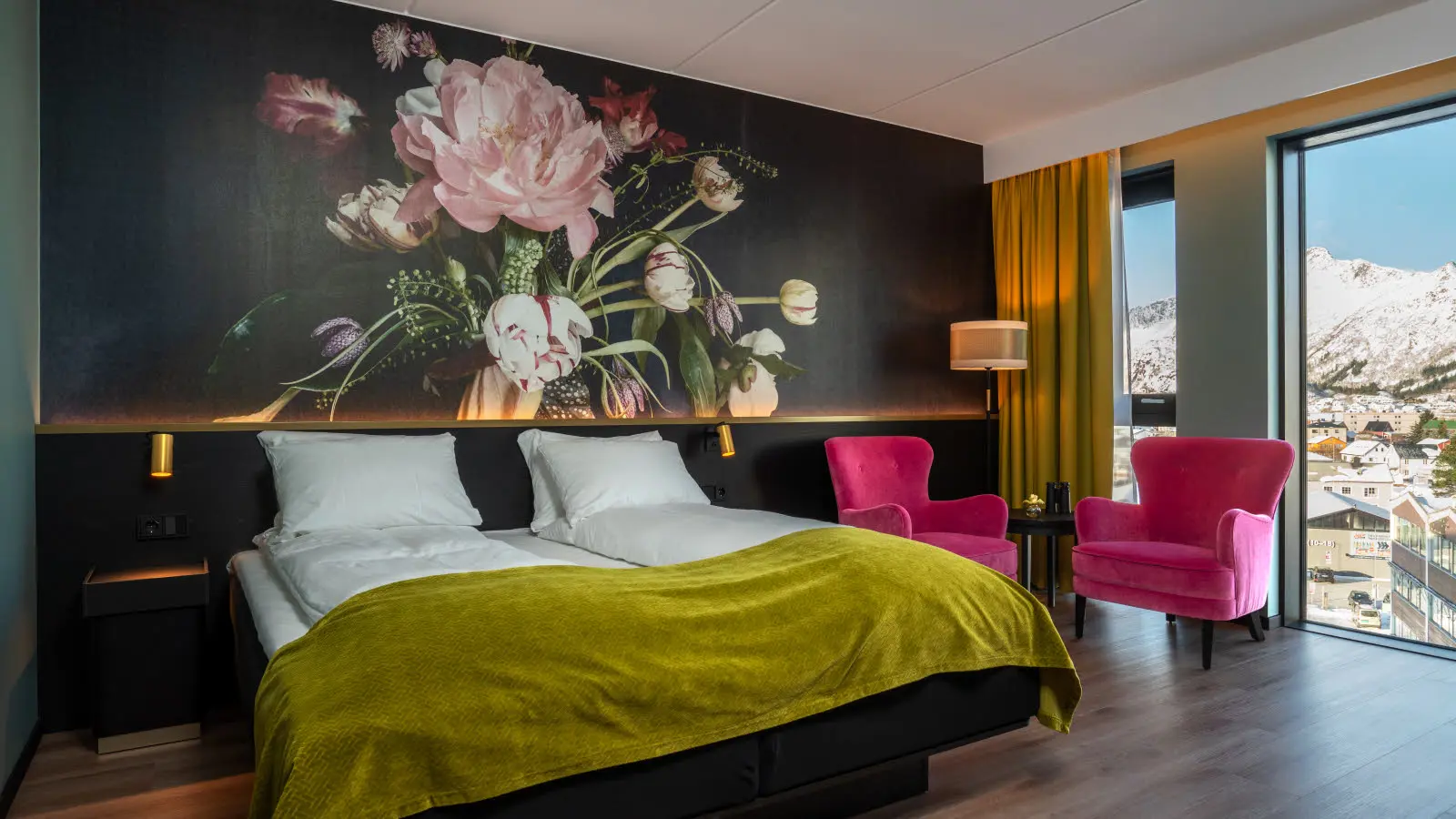 Suite at Thon Hotel Arendal with a large double bed and armchair next to it