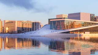 An evening view of the Oslo Opera House in Bjørvika, close to many of our hotels in Oslo